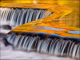 Yellow and orange reflections upstream from Bond Falls, Upper Michigan